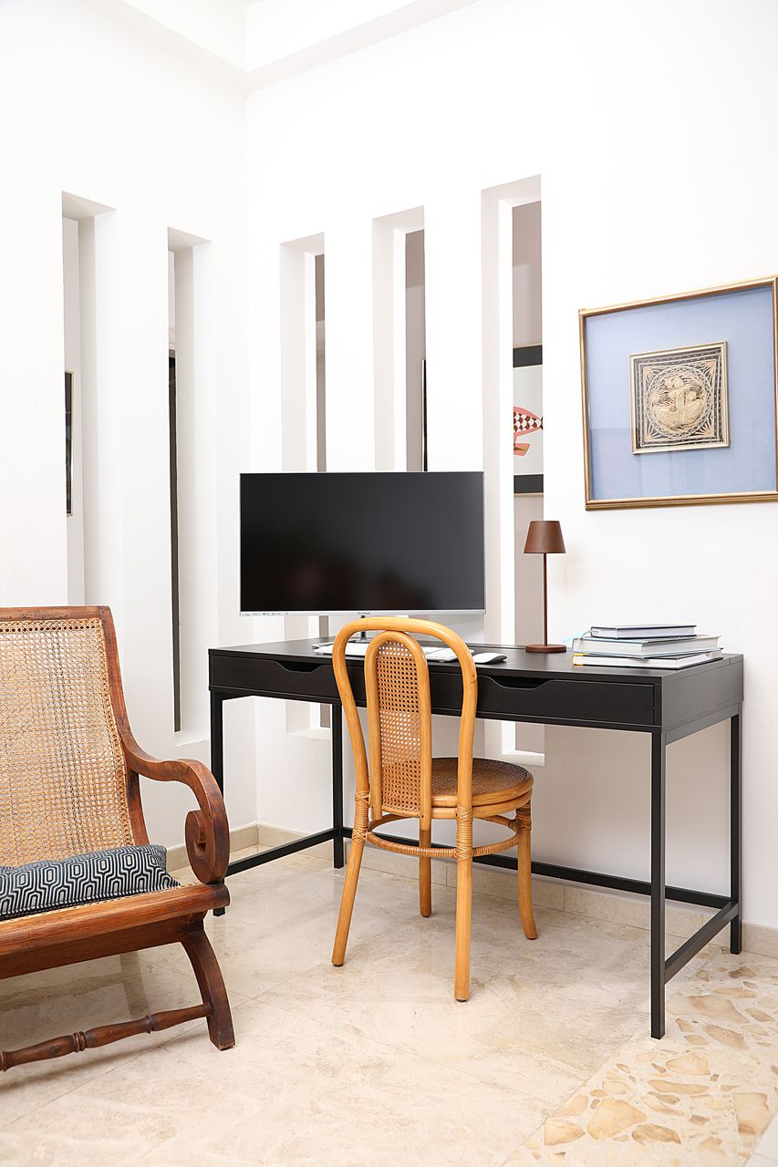 Desk in the bright patio beneath the skylight