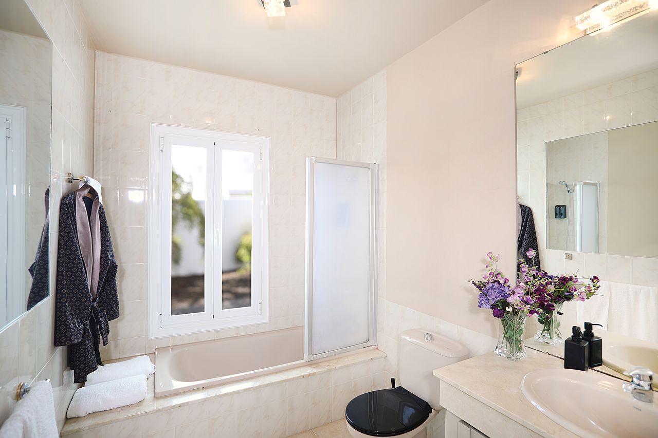 Bathroom with bathtub and window