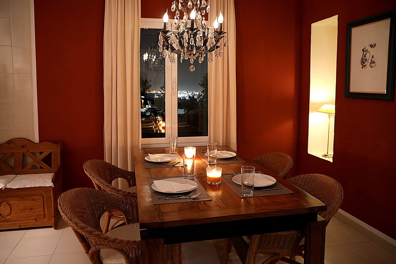 Dining area by candlelight with crystal chandelier