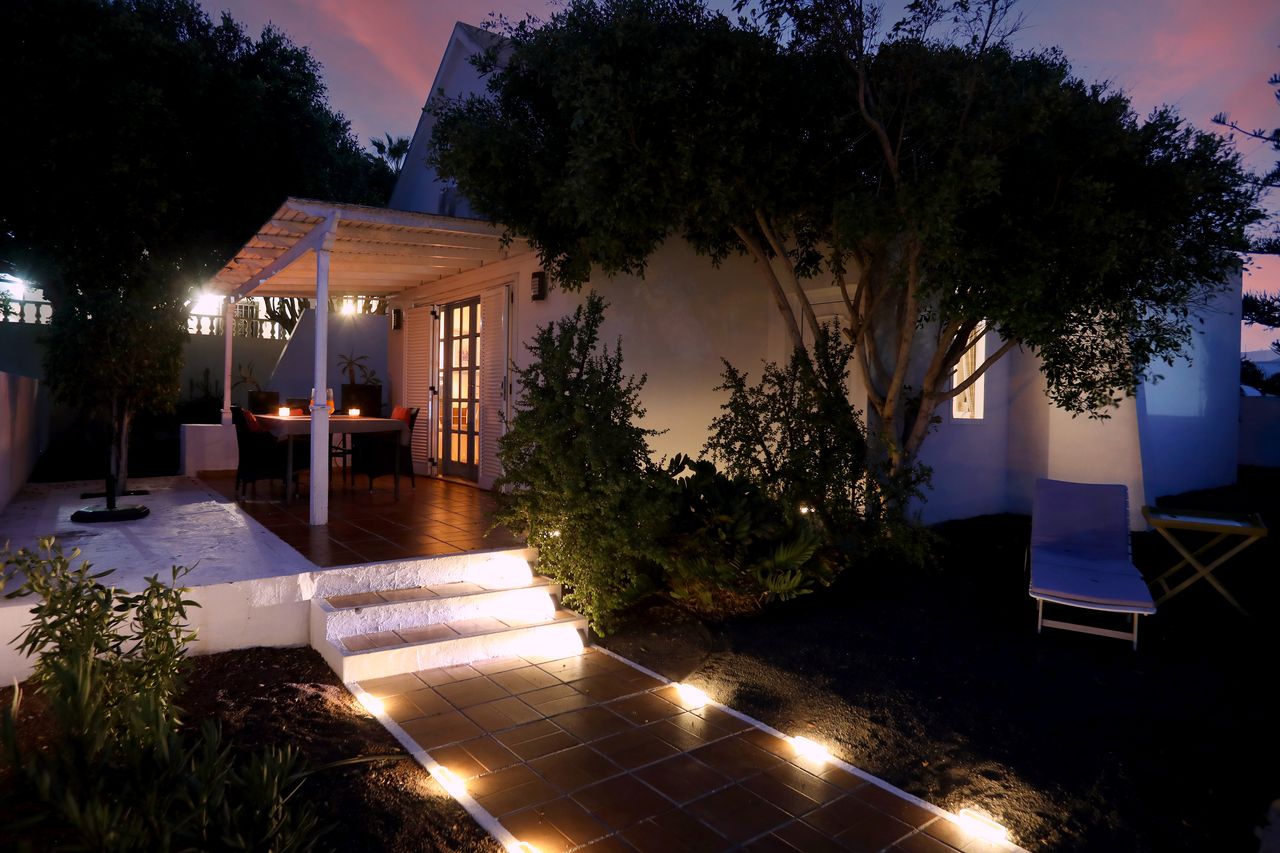 The garden at Casa Karen lit up in the evening