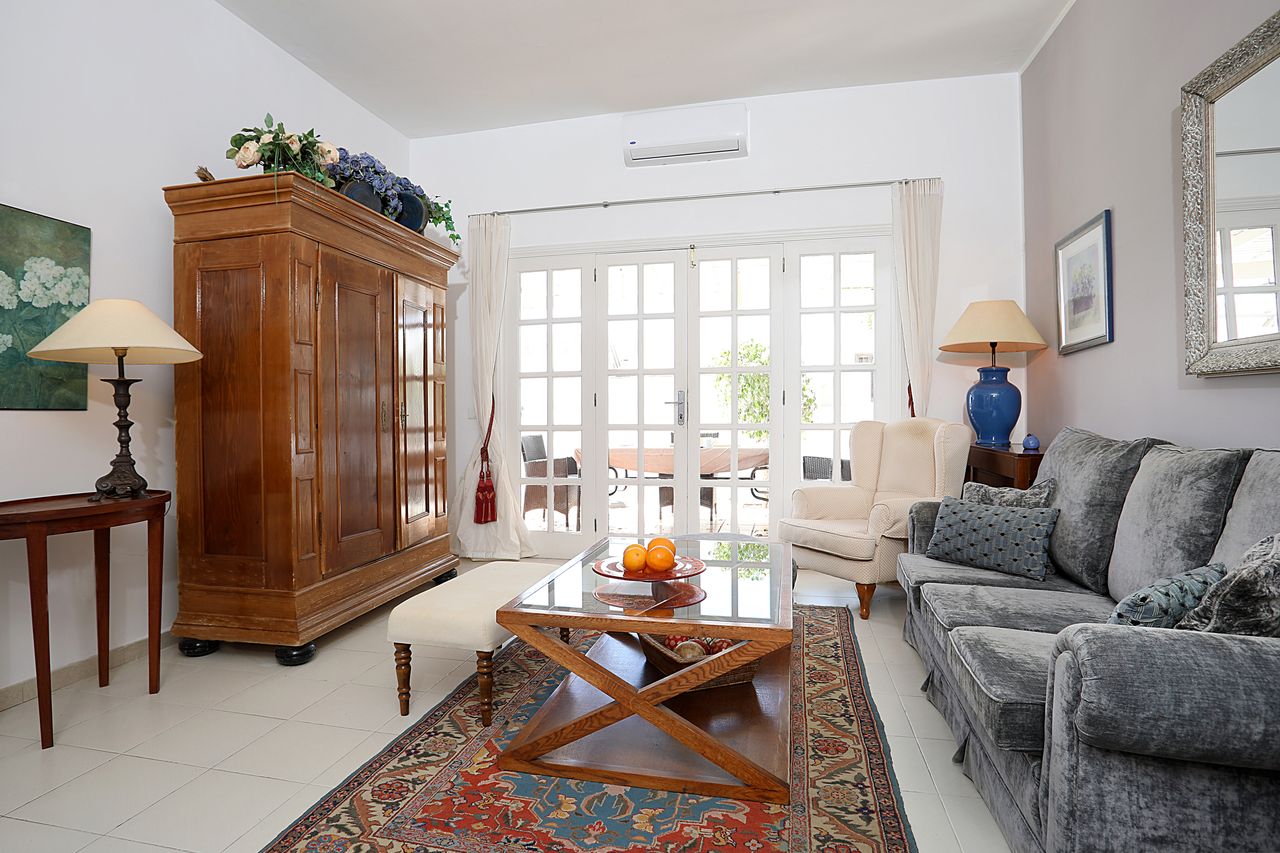 Living room with antique cabinet and sofa