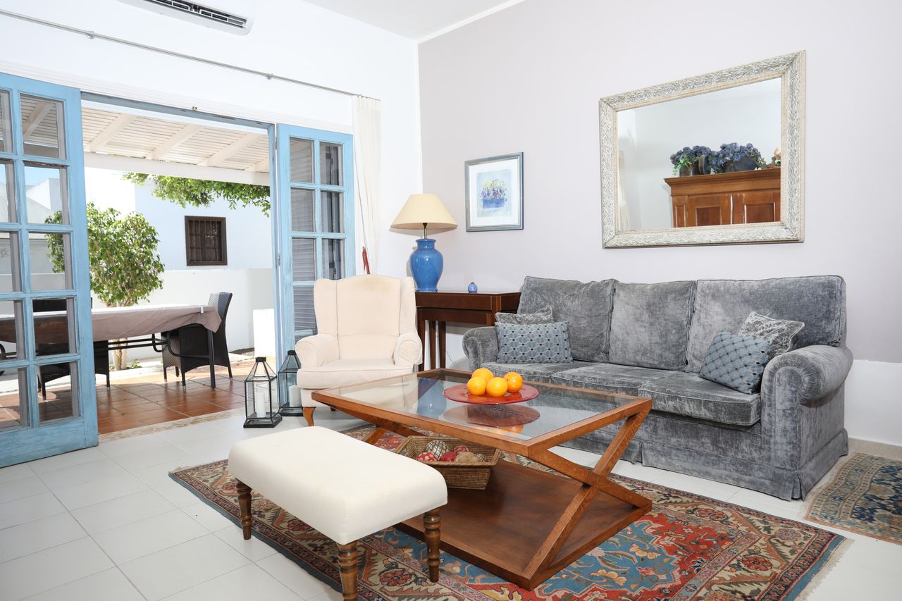 Bright living room with the doors open to the terrace